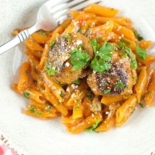 One Pan Pasta And Meatballs: the perfect one pot meal dinner idea! Tender homemade meatballs are cooked inside a tomato basil sauce served with penne pasta.