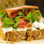 Open Faced Ham And Cheese Sandwich - delicious sandwich with goat cheese, pears, guava, watercress and ham topped with sweet honey. Easy, elegant and tasty!