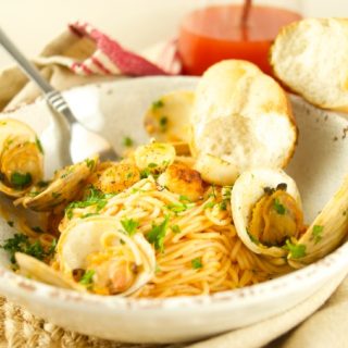 This Pasta With Clams And Scallops is ready in 30 minutes or less! The perfect quick & flavorful dinner idea for your family and friends. Loaded with flavor