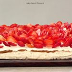This delicious Pavlova With Dulce de Leche is made with walnut meringue, dulce de leche, whipped cream, and strawberries. Just like the famous Miami Dessert!