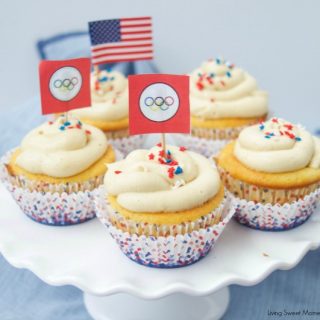 Peanut Butter And Jelly Cupcakes - delicious vanilla cupcakes filled with jelly and topped with peanut butter. The perfect dessert for any occasion.