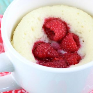 This moist and delicious Raspberry Sour Cream Mug Cake recipe is ready in 4 minutes or less and is topped with a yummy Vanilla Glaze. A quick dessert idea