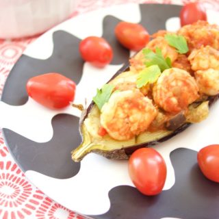 This delicious Shrimp Stuffed Eggplant Recipe is easy to make and is perfect for a nice weeknight dinner idea. The filling is inspired by Italian Caponata