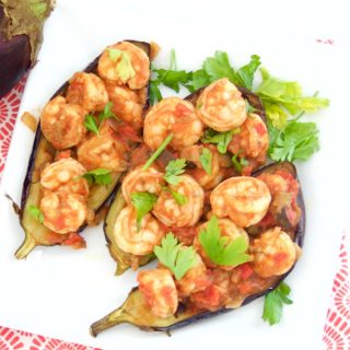 This delicious Shrimp Stuffed Eggplant Recipe is easy to make and is perfect for a nice weeknight dinner idea. The filling is inspired by Italian Caponata