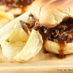 Slow Cooker Pulled BBQ Beef Sandwiches: delicious and tender beef slow cooked in a homemade BBQ sauce served on a toasted hamburger bun. Perfect for parties