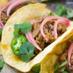 This scrumptious beef barbacoa tacos recipe is made quickly in the pressure cooker and served with homemade pickled onions. Perfect for dinner and parties.