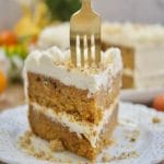 This stunning spiced Orange Ginger Carrot Cake is moist, tender, and delicious. Covered with cream cheese frosting. Have a slice!