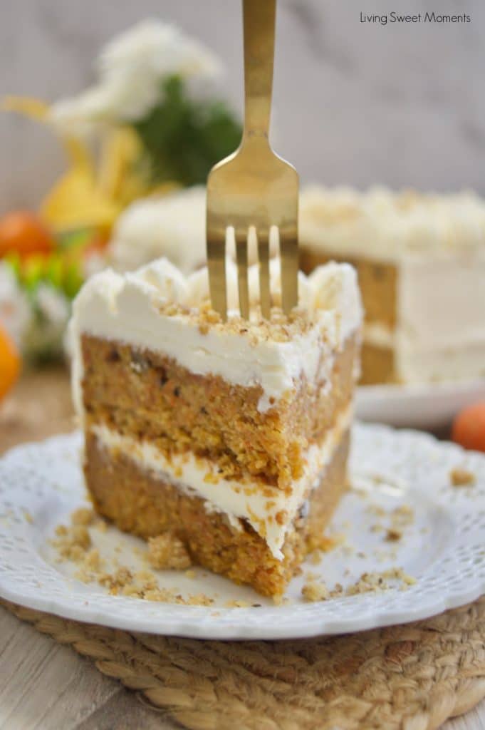 This stunning spiced Orange Ginger Carrot Cake is moist, tender, and delicious. Covered with cream cheese frosting. Have a slice!