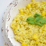This Spicy Mango Rice recipe is easy to make and delicious. The perfect side dish to any dinner or for entertaining. Made with chili, cilantro, lime & mango