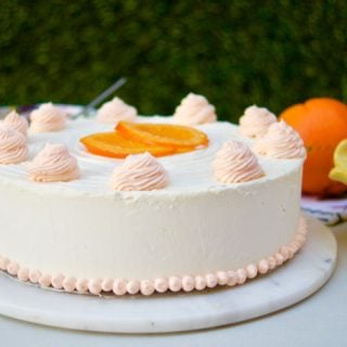 This amazing Succulent Orange Curd Cake consists of 3 layers of moist orange cake filled with orange curd and topped with Swiss vanilla buttercream.