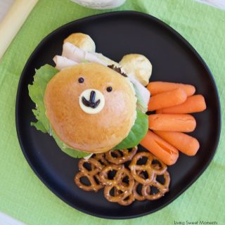 Check out how to make these delicious & adorable Teddy Bear Sandwich Buns served with carrots, and pretzels. Perfect to take to school