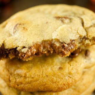 Truffle Stuffed Chocolate Chip Cookies - these chewy chocolate chip cookies are ooey gooey and stuffed with a chocolate truffle. The best cookie recipe! Yum