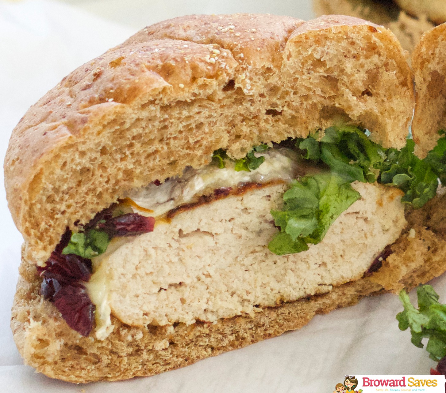 Turkey burger topped with melted brie and cranberry